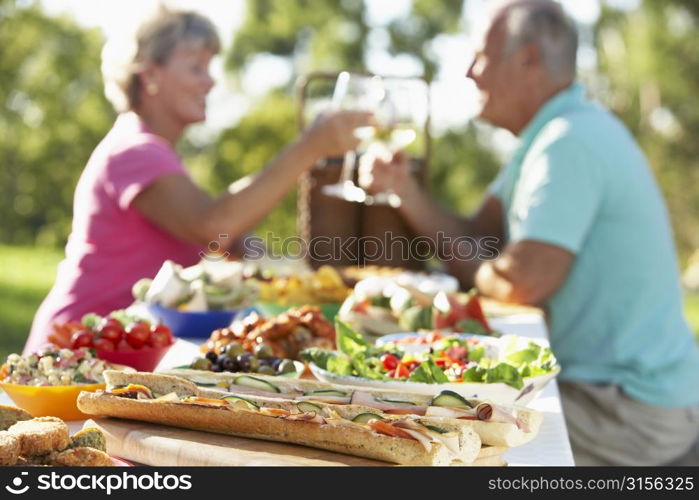 Couple Dining Al Fresco, Toasting Each Other