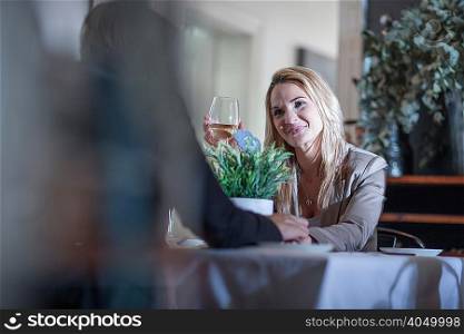 Couple dining and chatting in restaurant