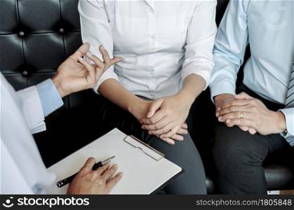 Couple Discussing Problems with Psychiatrist and Relationship Counselor