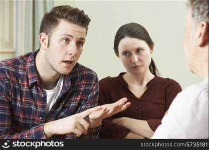 Couple Discussing Problems With Relationship Counsellor