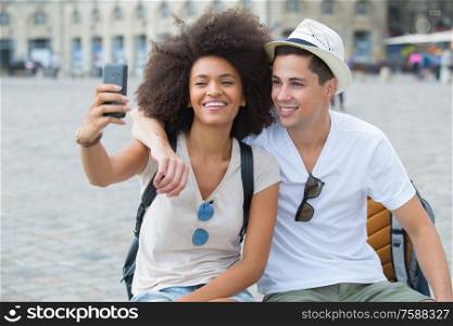 couple doing a selfie in sight seeing in destination city
