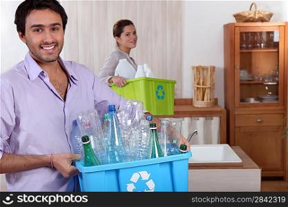 couple doing recycling