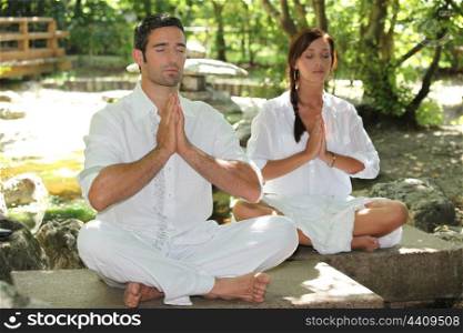 Couple doing relaxation exercises