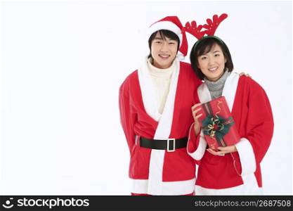 Couple dressed as santa