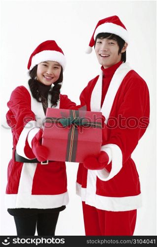 Couple dressed as santa