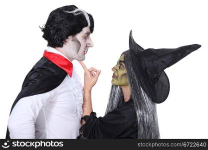 Couple dressed as witch and vampire