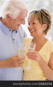 Couple drinking champagne and smiling