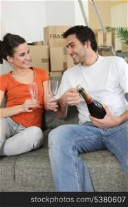 couple drinking champagne at home