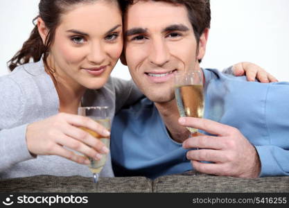Couple drinking champagne to celebrate anniversary