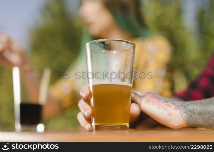 couple drinking craft beer outdoors