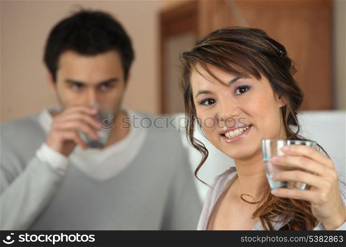 couple drinking glass of water
