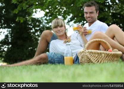 couple drinking orange juice
