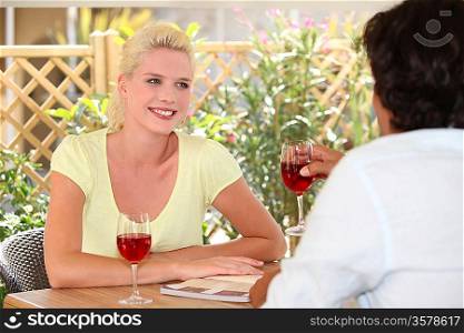 Couple drinking wine outdoors