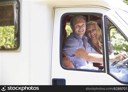 Couple Driving Motor Home On Vacation