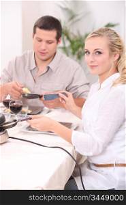 Couple eating a raclette