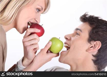 Couple eating apples