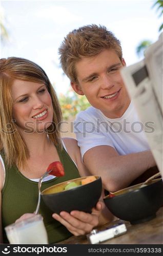Couple Eating Bowls of Fruit