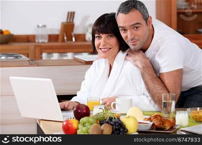 Couple eating breakfast in the kitchen