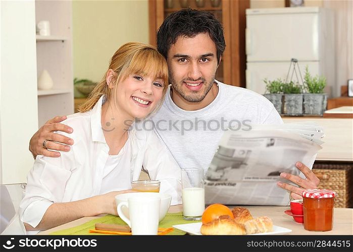 Couple eating breakfast together