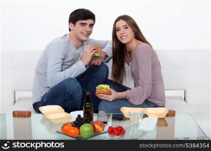Couple eating fast food