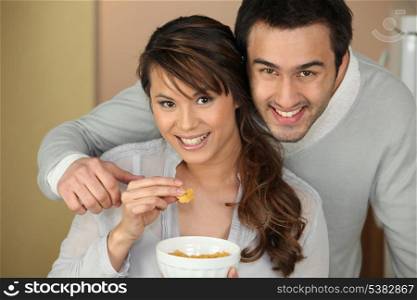 Couple eating from bowl
