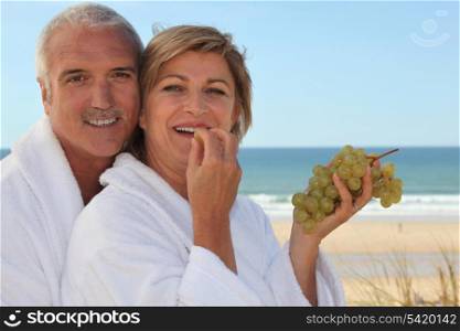 Couple eating grapes