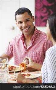Couple Eating Meal Together At Home