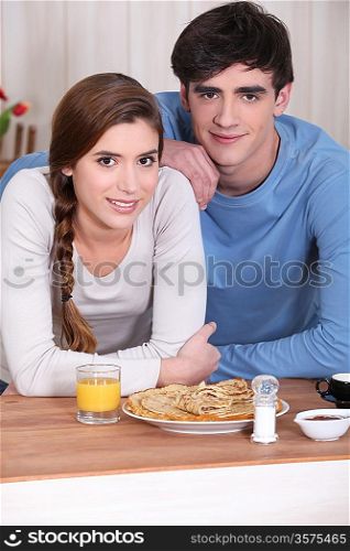 Couple eating pancakes