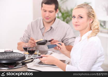 Couple eating raclette