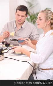 Couple eating raclette