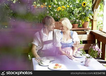 Couple eating together outdoors