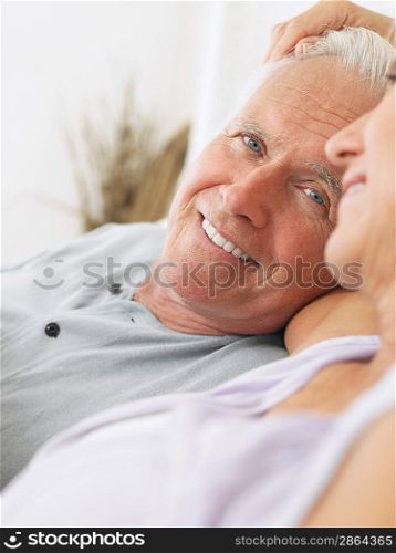Couple embracing and smiling close-up