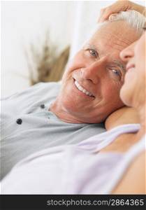 Couple embracing and smiling close-up