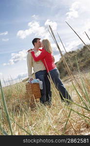 Couple embracing at beach