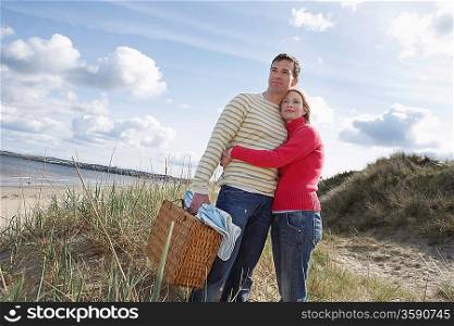 Couple embracing at beach