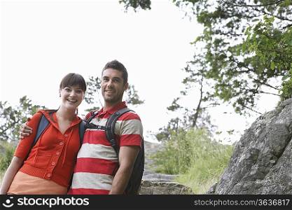 Couple embracing in countryside, portrait