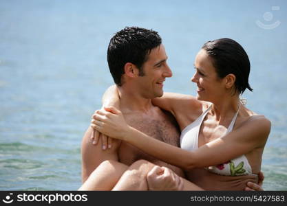 Couple embracing in the sea