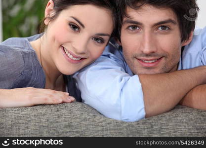 Couple embracing on couch