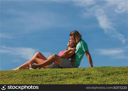 Couple embracing on meadows