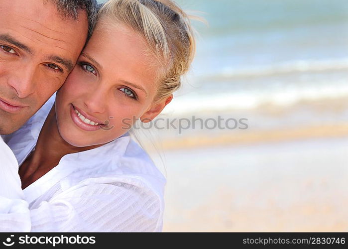 Couple embracing on the beach