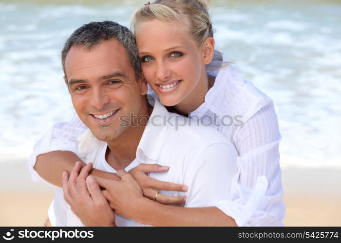 Couple embracing on the beach