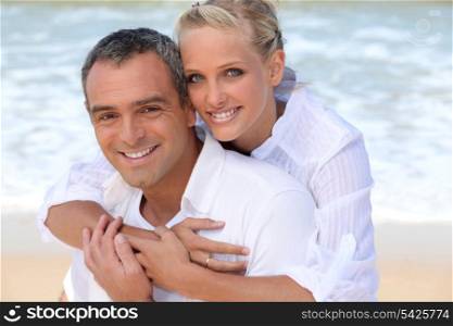 Couple embracing on the beach