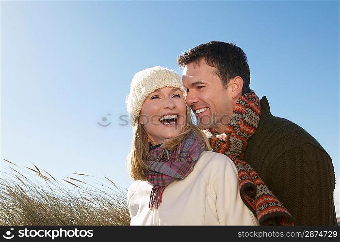 Couple embracing outdoors