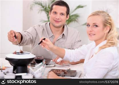 Couple enjoying a chocolate fondue