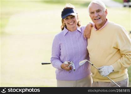 Couple Enjoying A Game Of Golf