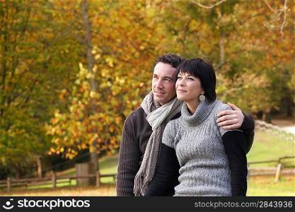 Couple enjoying autumnal walk in the park