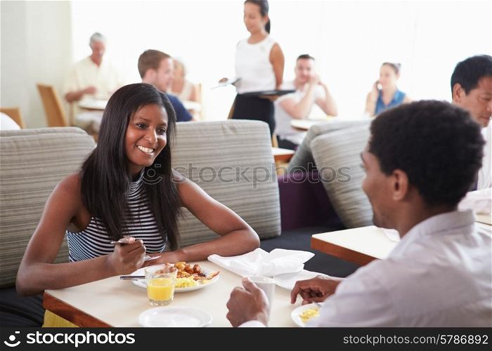 Couple Enjoying Breakfast In Hotel Restaurant