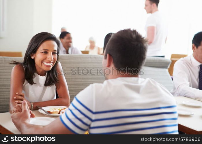 Couple Enjoying Breakfast In Hotel Restaurant