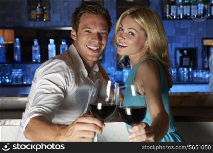 Couple Enjoying Drink In Bar