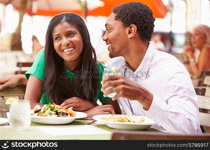 Couple Enjoying Lunch In Outdoor Restaurant